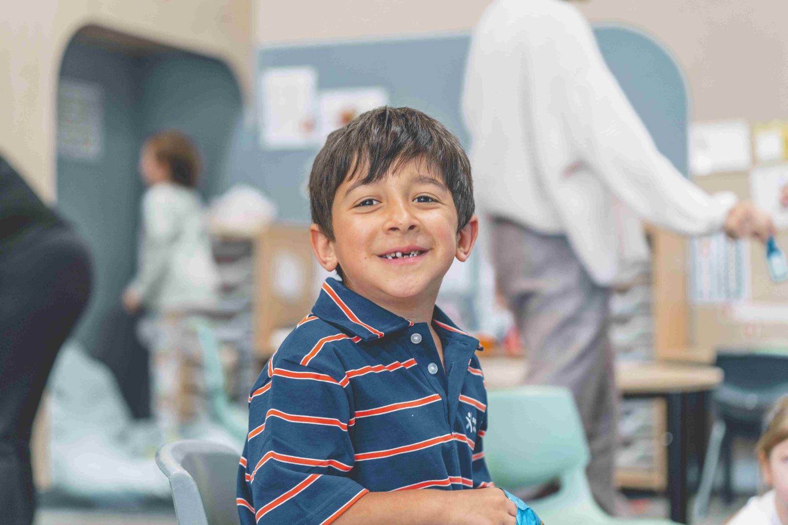 Student smiling in classroom learning environment